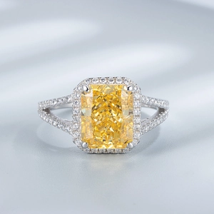 Macro detail of radiant cut yellow carbon diamond engagement ring with split shank in S925 silver
