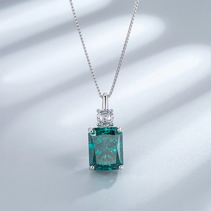 Detailed macro shot of S925 silver necklace with emerald cut zircon stone pendant