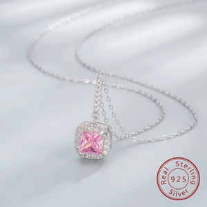 Macro detail of square pink zircon pendant on a 925 sterling silver chain necklace