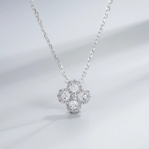 Close-up of S925 sterling silver four-leaf clover necklace with pear-cut zircon stones