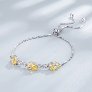 Verstelbare S925 zilveren armband met gele edelstenen en oneindigheidssymbolen