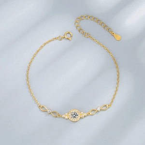 Golden S925 sterling silver bracelet with infinity links and sparkling zircon stones