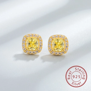 Close-up of S925 sterling silver stud earring with yellow square gemstone and halo crystals