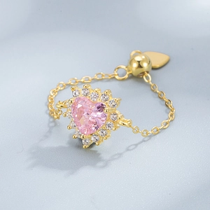 Adjustable 925 silver chain ring with a pink heart-shaped stone and gold accents