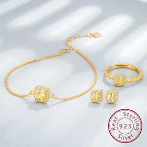 Détails d'ensemble de bijoux en argent S925 avec pierres carrées jaunes et halo de diamants