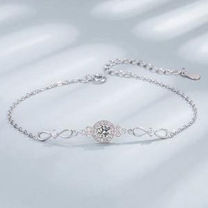 Macro detail of S925 sterling silver infinity bracelet featuring round cubic zirconia stone