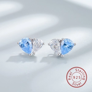 Detail of S925 sterling silver heart studs with blue and clear pear-cut zircon stones
