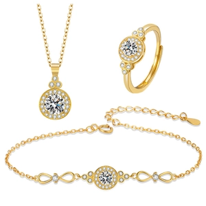 Sparkling gold jewelry set featuring necklace, infinity bracelet and adjustable ring