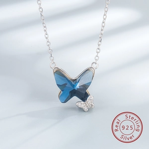 Close-up of S925 sterling silver butterfly necklace with deep blue crystal and zircon