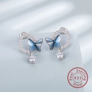 Detail of S925 sterling silver butterfly earrings with blue crystal and zircon stones