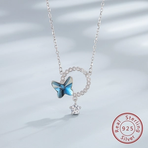 Close-up of S925 silver necklace with blue crystal butterfly and star zircon pendant