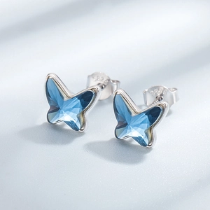 Elegant S925 silver butterfly stud earrings featuring multifaceted blue crystals