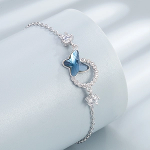 Silver butterfly bracelet with deep blue crystal and zircon pave in luxury style