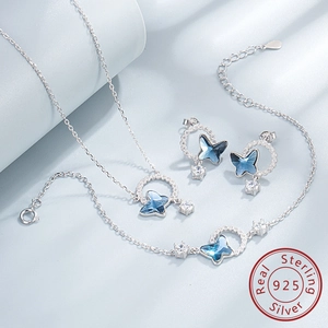 Close-up of S925 silver jewelry set with gradient blue butterfly crystals and zircons