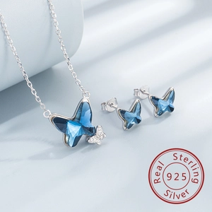Detailed close-up of 925 sterling silver butterfly jewelry set with blue crystals