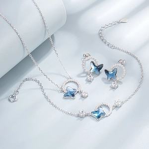 S925 sterling silver jewelry set featuring blue butterfly crystals and pavé diamonds