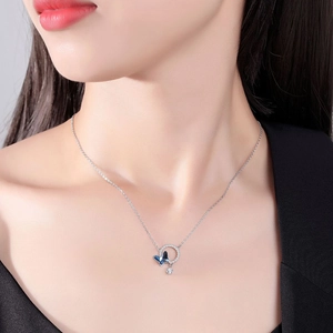 Detailed view of S925 silver necklace with blue butterfly pendant and sparkling crystals