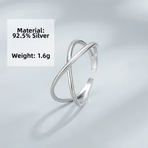Macro shot of S925 sterling silver minimalist double layer criss-cross open ring