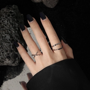 Minimalist S925 sterling silver layered cross open rings on model with dark background