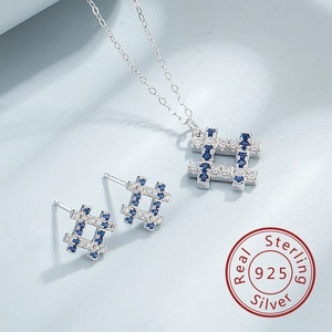 Detail of S925 sterling silver necklace and earrings set with blue zircon hashtag design