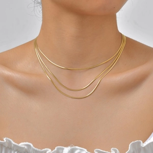 Three-layer 18K gold plated stainless steel flat snake chain necklace on female model
