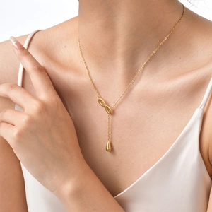 Golden stainless steel Y-shaped necklace featuring infinity symbol and teardrop pendant