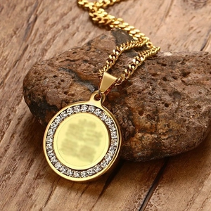 Polished gold stainless steel necklace with zircon pavé pendant on natural stone base