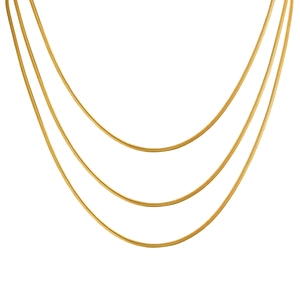 Three-layer 18K gold plated stainless steel flat snake chain necklace on white background