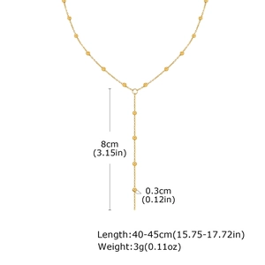 Detail showing Y-shape gold chain necklace with 8cm drop and 0.3cm bead dimensions