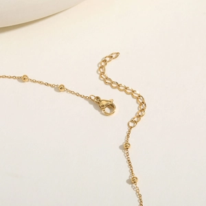 Gold stainless steel Y-necklace with small round beads and lobster clasp detail