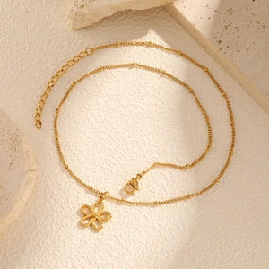 Elegant gold stainless steel necklace featuring a hollow flower pendant and bead chain