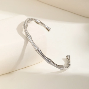 Detailed view of silver bamboo joint textured open cuff bracelet in stainless steel