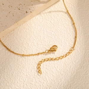 Collier doré en acier inoxydable à perles avec fermoir mousqueton et chaîne d'extension