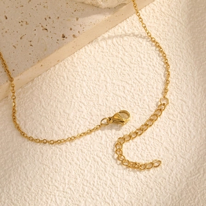 Detailed macro view of 18K gold plated chain with lobster clasp and adjustable links