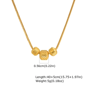 Detail view of gold stainless steel snake chain with three engraved cylindrical beads