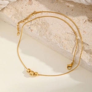 Golden stainless steel snake chain necklace with three spiral textured beads for women
