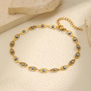 Detailed view of 18K gold stainless steel evil eye anklet with embossed texture on stones