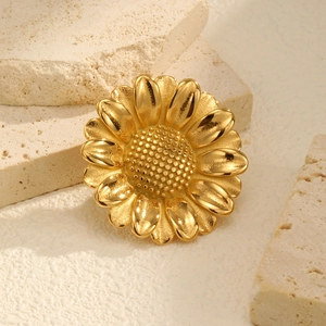 Broche marguerite en acier inoxydable plaqué or 18K sur socle en pierre sobre