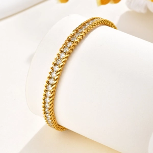 Chevillère femme en acier inoxydable plaqué or 18K avec double chaîne et zircons blancs
