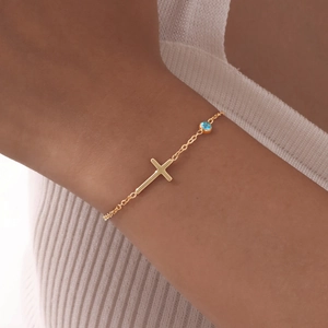 Minimalistisches goldenes Edelstahl Kreuzarmband mit blauem Edelstein für Damen