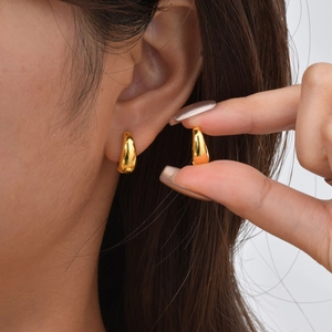 Polished gold U-shaped drop earrings with minimalist smooth metallic finish for women