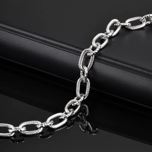 Men's minimalist stainless steel linked chain bracelet with textured embossed oval links
