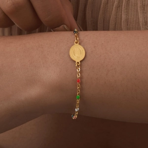 Detail of 18K gold plated bracelet with colorful enamel beads and Virgin Mary medal