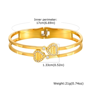 Detail view of gold stainless steel bangle with Forever Love heart charms and 17cm perimeter