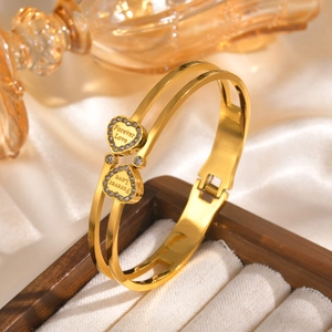 Detail of Roman numeral stainless steel bangle with rhinestone hearts and Forever Love text
