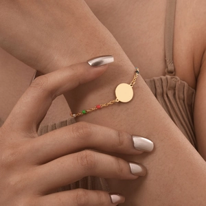 Colorful bead stainless steel bracelet with golden Virgin Mary pendant on female model