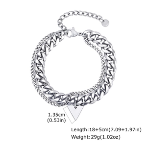 Detail of double-layer stainless steel curb chain bracelet with triangle charm and lobster clasp