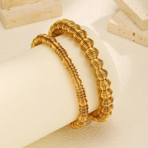 Unisex golden spring coil expandable arm cuff bracelet with intricate spiral wire texture