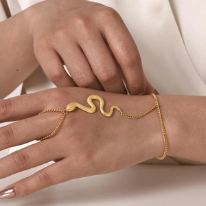 Golden snake finger bracelet with scale texture in a minimalist boho style for women