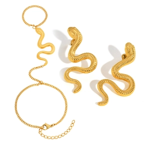 Gold stainless steel snake ring bracelet set and matching stud earrings on white